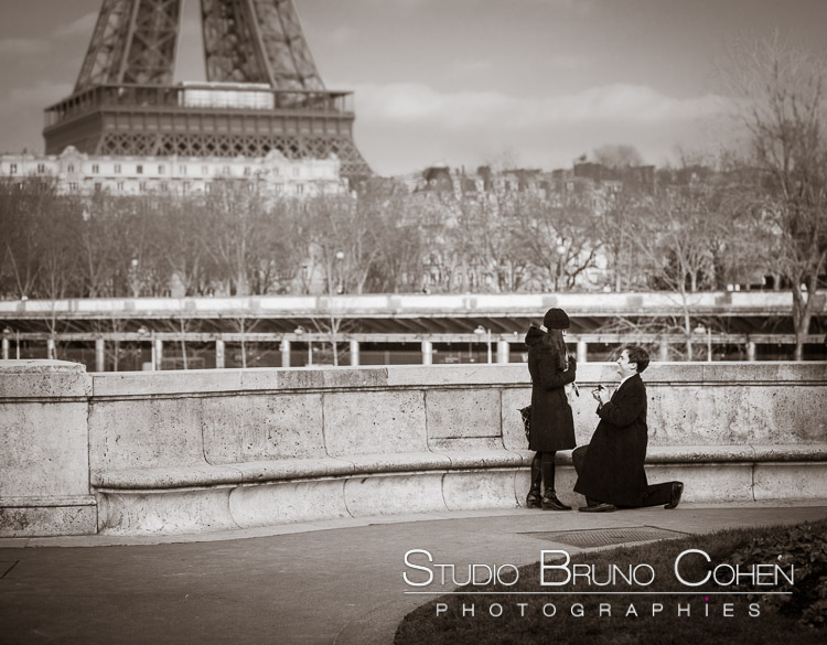surprise proposal in paris couple love front of Eiffel Tower black and white