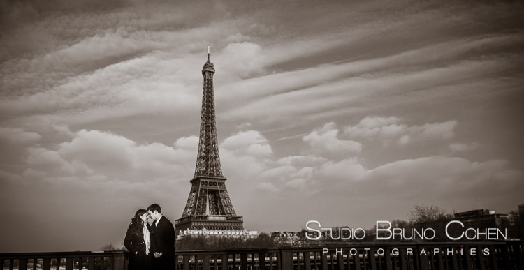 portrait couple forehead against forehead in paris proposal front of Eiffel Tower love emotion passion 