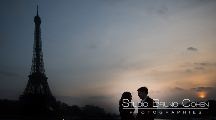 portrait couple face to face love front of Eiffel Tower at sunset proposal 
