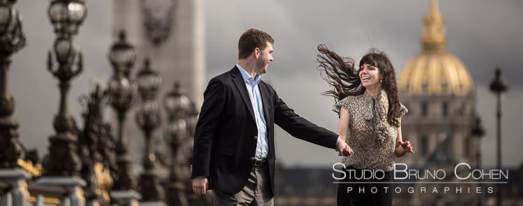 portrait couple hand in hand run at Alexandre three bridge proposal in paris