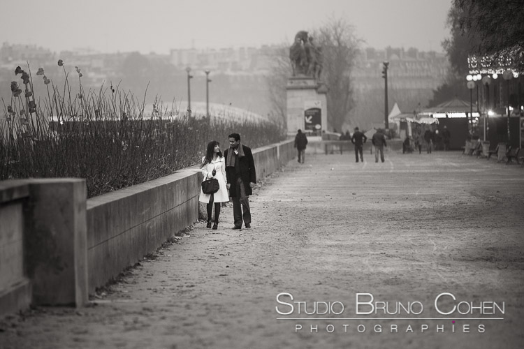 portrait couple in love walk in paris at sunset winter black and white