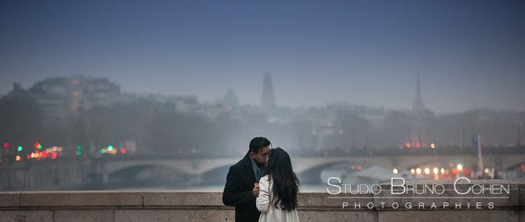 portrait kissing couple in paris engagement session at night winter love kiss