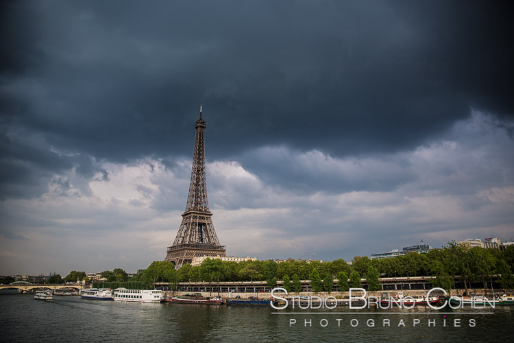 proposal in paris Eiffel Tower cloudy storm