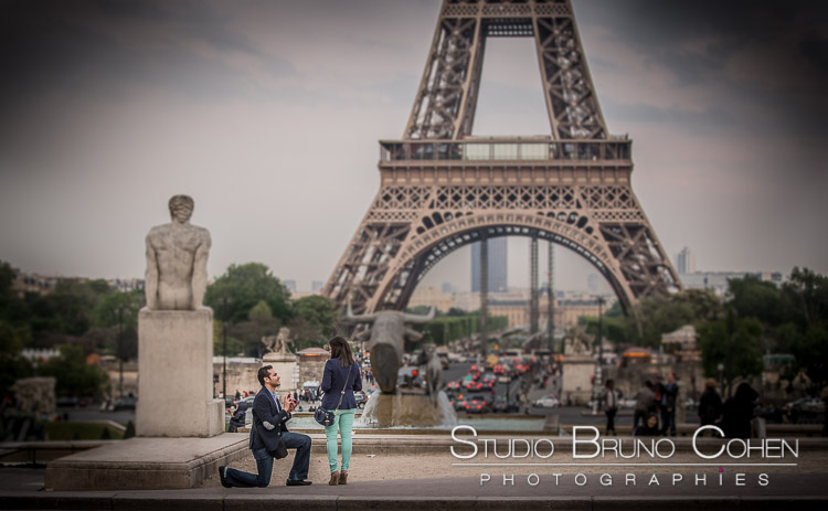 surprise proposal in paris from Trocadero front of Eiffel Tower couple in love emotions