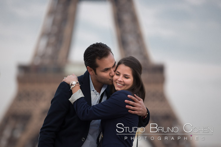 portrait couple kiss lady cute from Trocadero front of Eiffel Tower in paris 