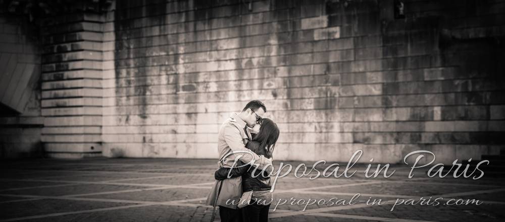 kissing couple in paris proposal near eiffel tower