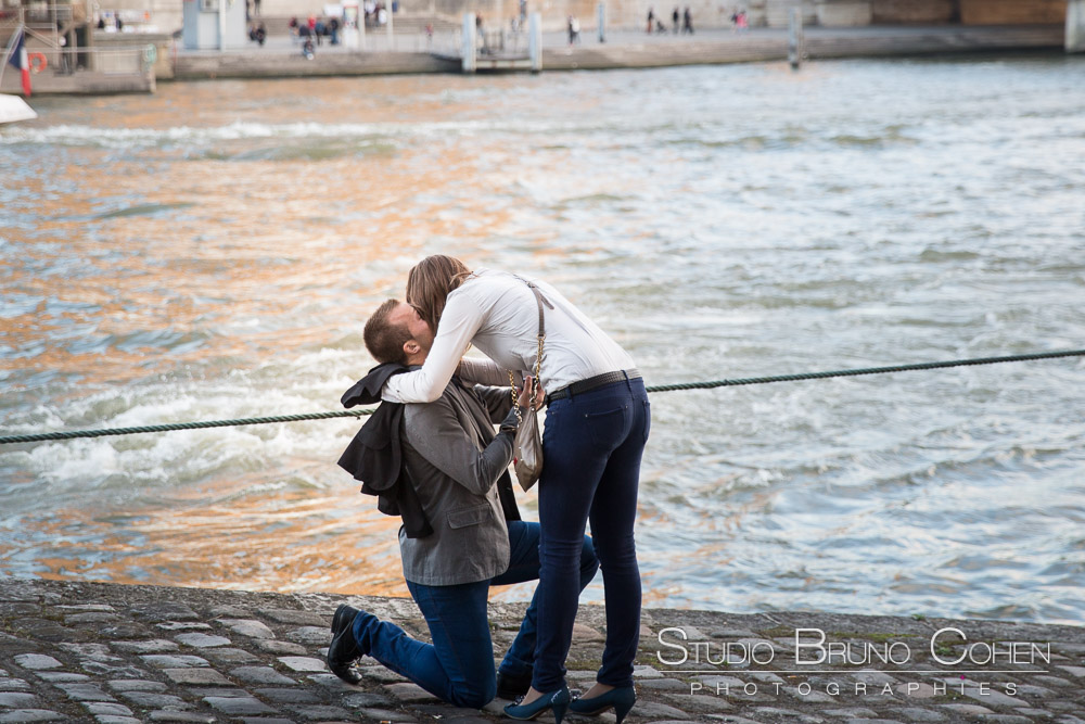 surprise proposal in paris front of eiffel tower kissing couple emotions at sunset