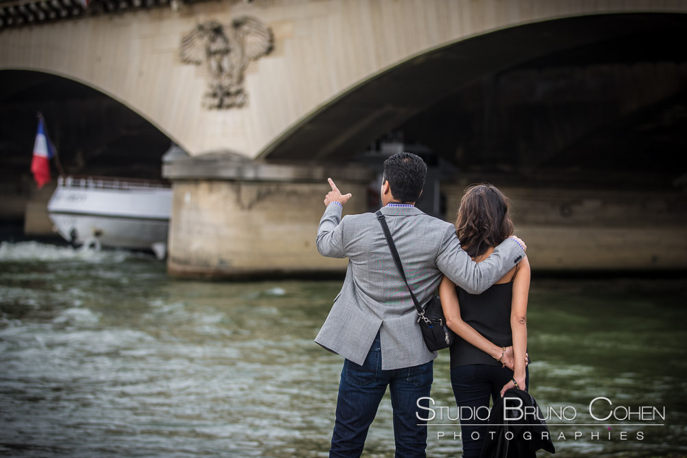 couple in love from paris proposal portrait quai de seine near eiffel tower