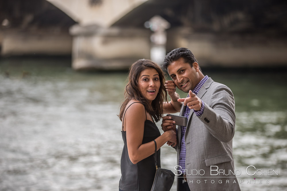 surprise proposal in paris front of eiffel tower on quai de seine hidden photographer emotions