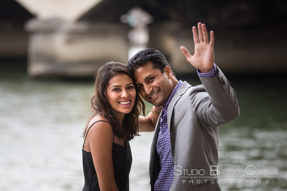 surprise proposal in paris front of eiffel tower on quai de seine couple in love 