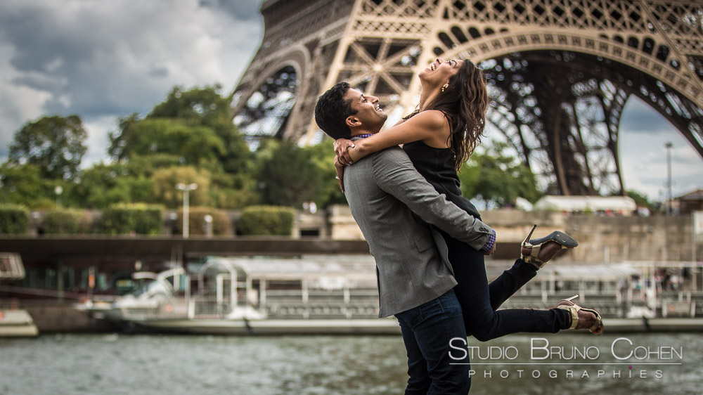 couple in love jumping lady proposal in paris front of eiffel tower emotions smile happy
