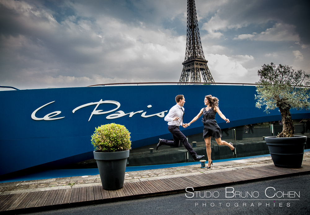 jumping couple in paris front of eiffel tower love