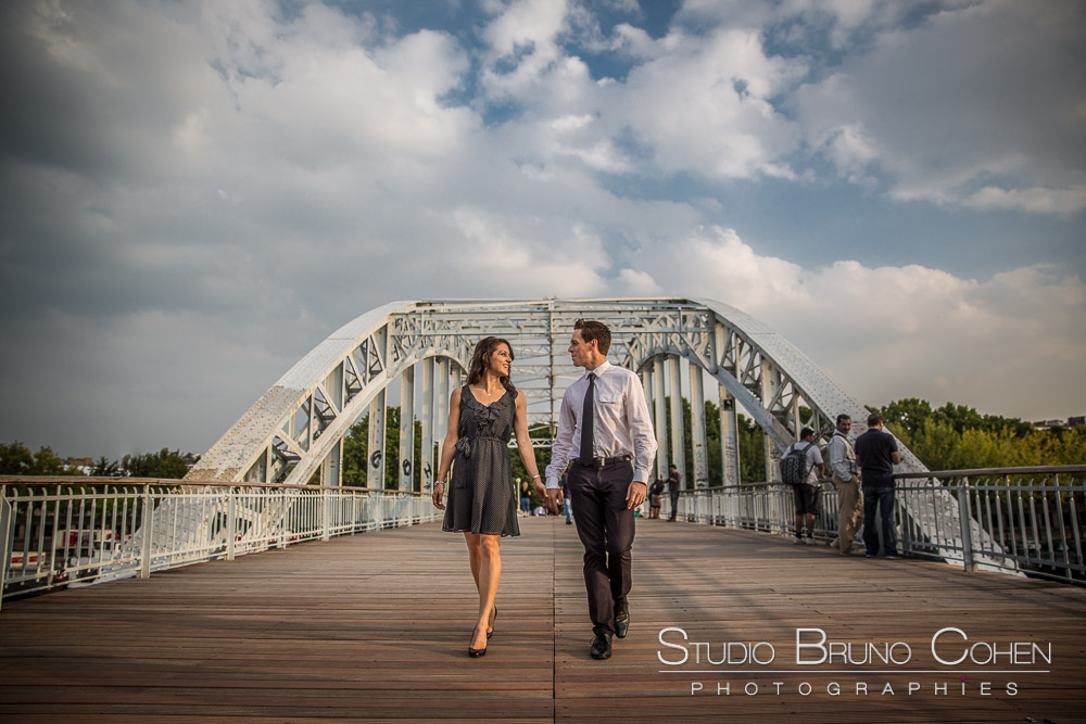 portrait couple walk in paris from debilly walkway proposal at summer sunset
