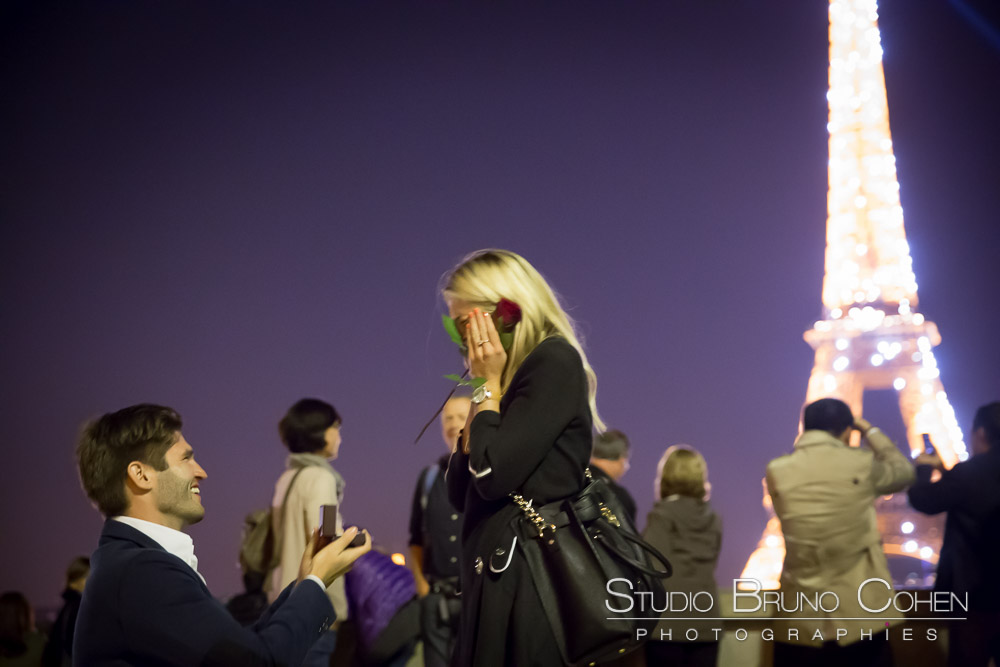 surprise proposal in paris at night from trocadero front of eiffel tower sparkles emotions cry happy