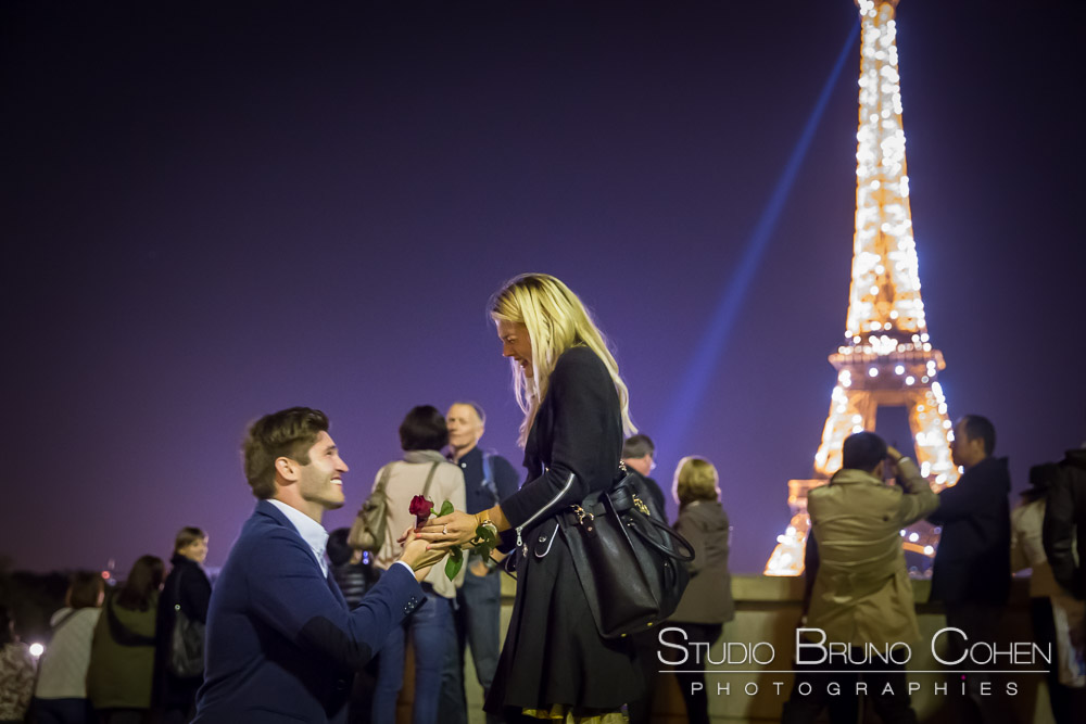 surprise proposal in paris at night from trocadero front of eiffel tower sparkles emotions cry happy
