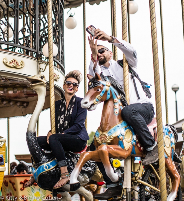 couple ride on horses from eiffel tower carousel proposal in paris