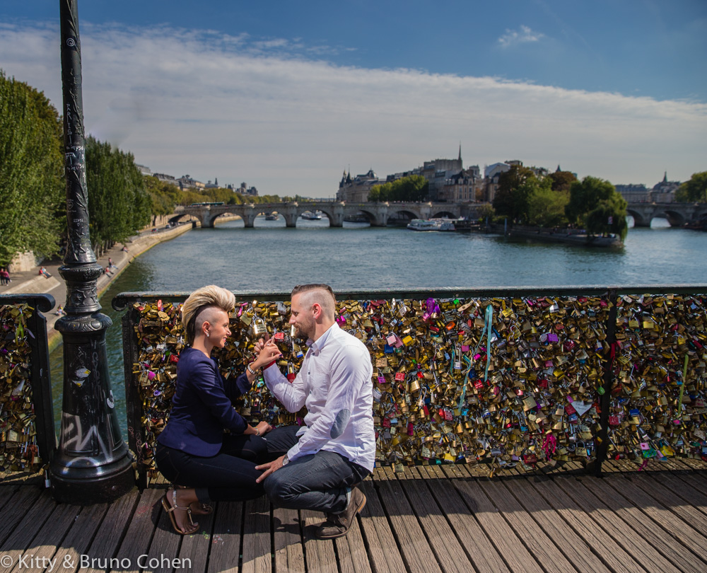 couple in love face to face from locks bridge paris proposal emotions