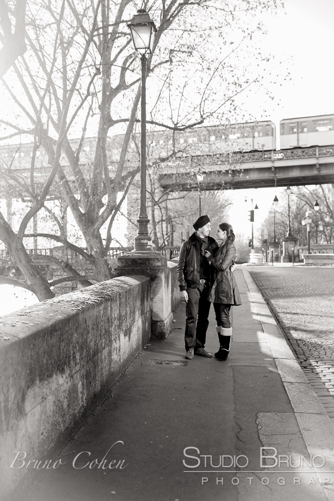 hugging couple hold on paris street in love proposal at winter black and white 