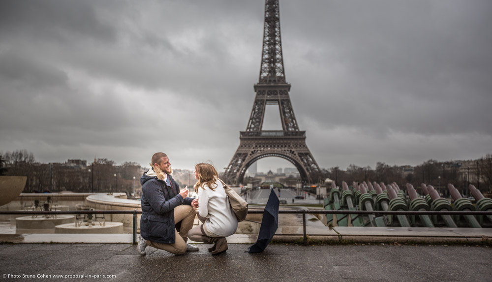 surprise proposal in Paris from Trocadero square front of Eiffel Tower at winter morning emotions cry 