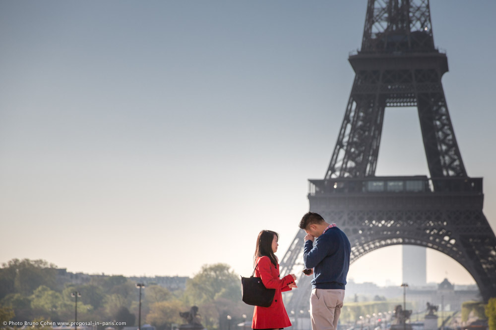 surprise proposal in paris from Trocadero front of Eiffel Tower at sunrise emotions cry couple in love 