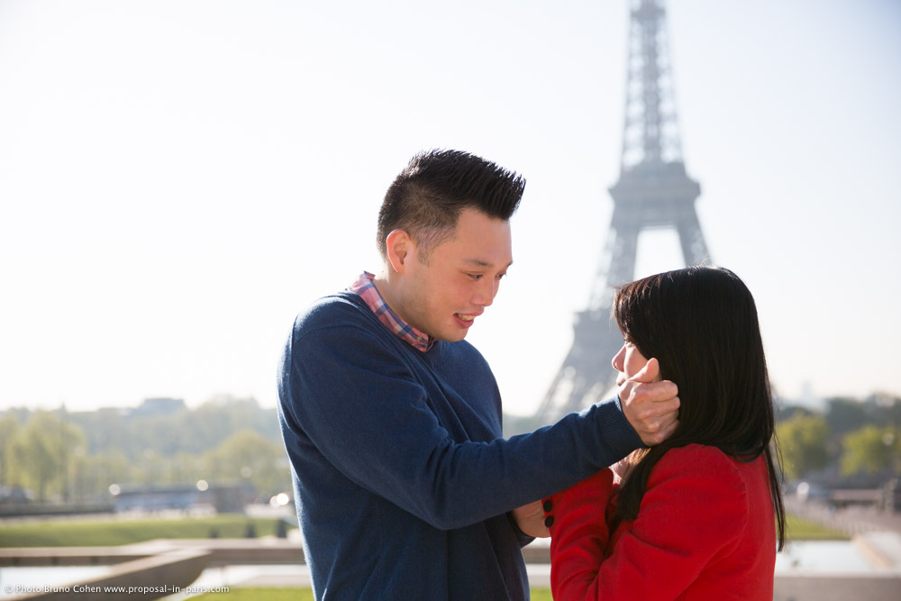 emotional couple in paris front of Eiffel Tower from Trocadero at sunrise