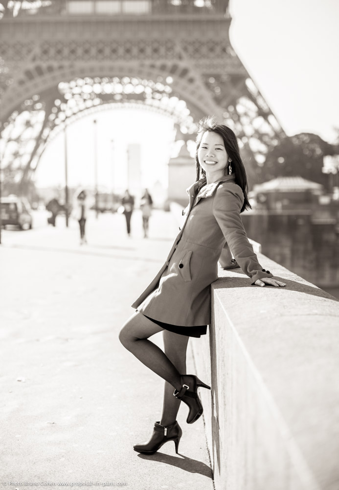 portrait lady in dress in paris front of Eiffel Tower at sunrise black and white