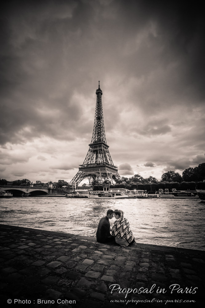 engagement session in Paris couple in love forehead to forehead from seine banks black and white