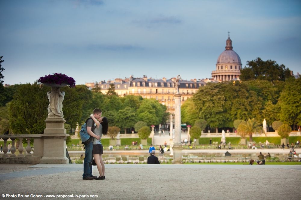 romantic walk in Luxembourg gardens kissing couple proposal in paris at sunrise love