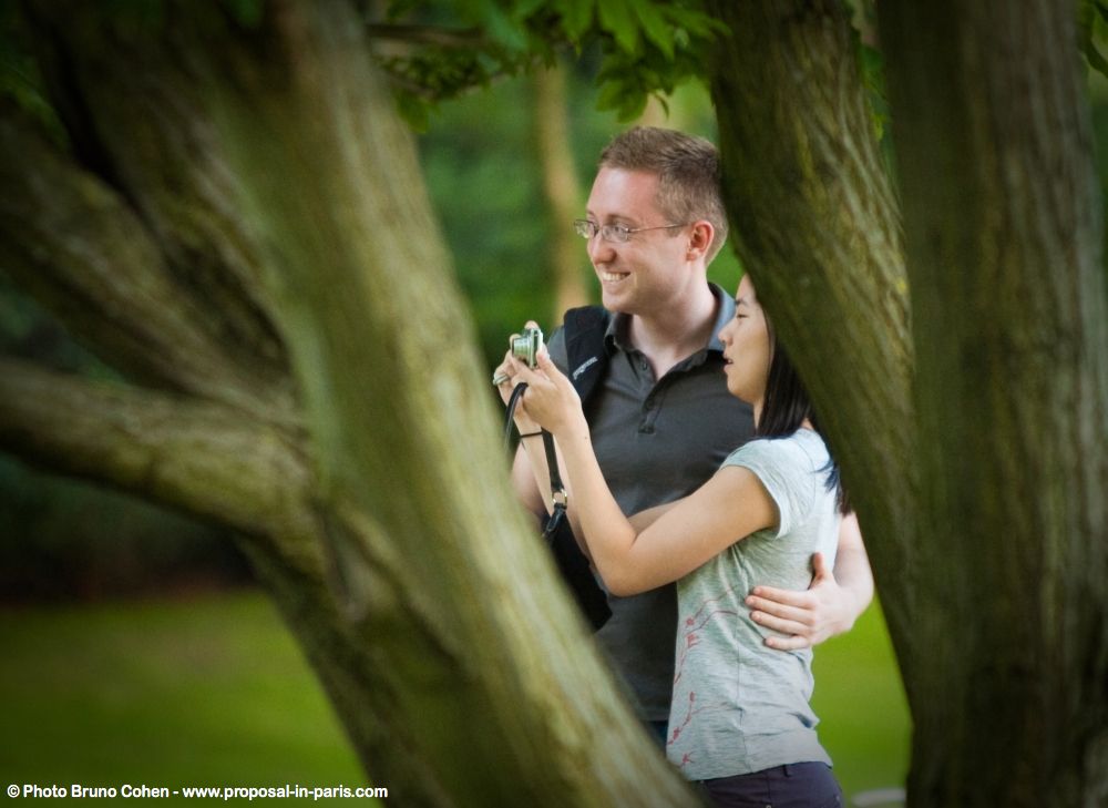 portrait couple in love romantic proposal in paris from Luxembourg gardens smile