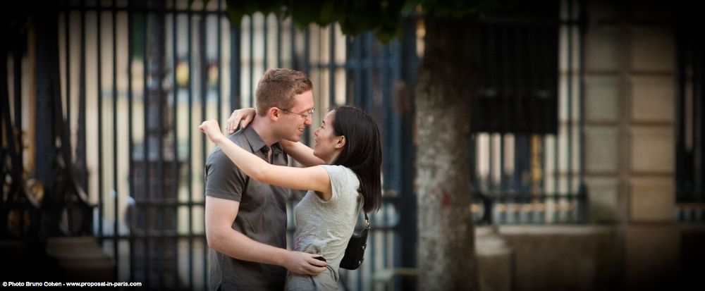 kissing couple in paris proposal in love focus portrait
