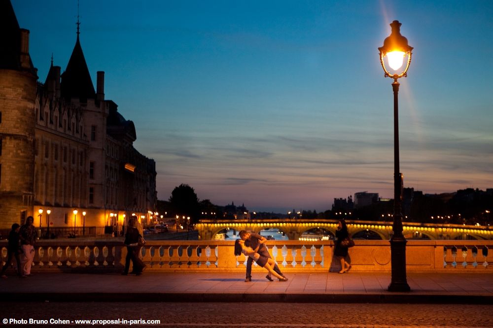 romantic shoot in paris proposal at sunrise moment emotions couple dancing on bridge sky perfect