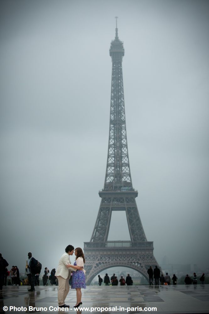 asian couple in love from Trocadero front of Eiffel Tower proposal