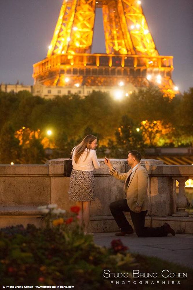 surprise proposal in paris at night couple emotions cry from bir hakeim bridge