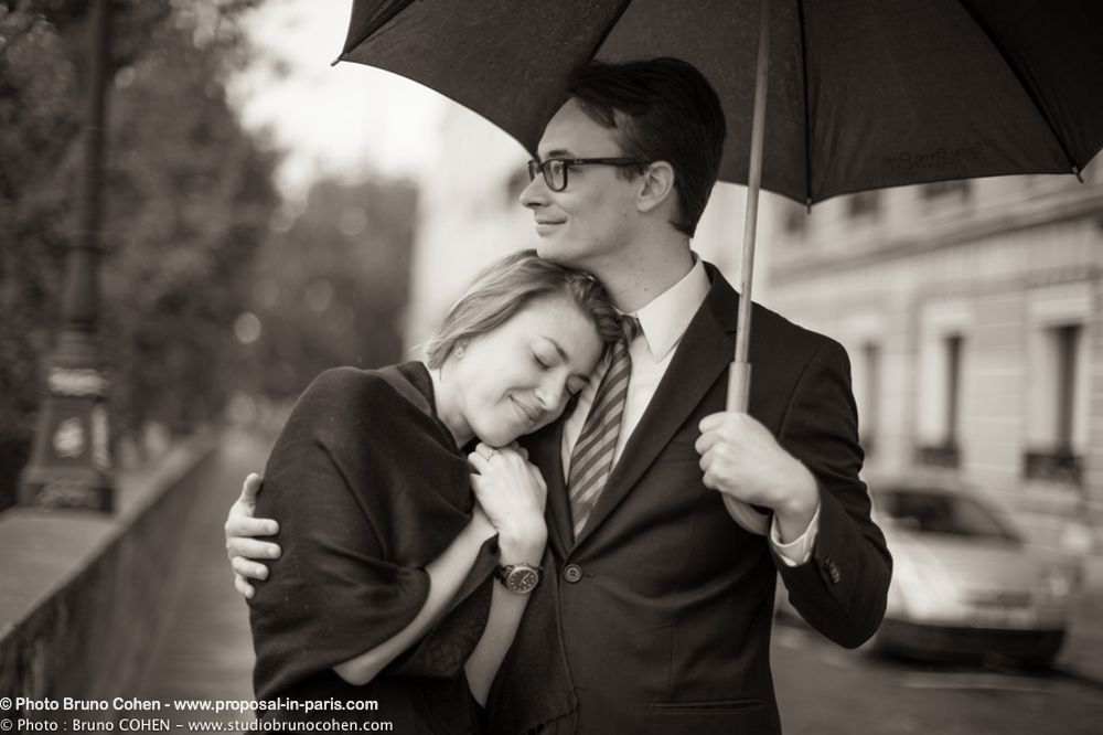 portrait couple hugging in love umbrella cute from paris