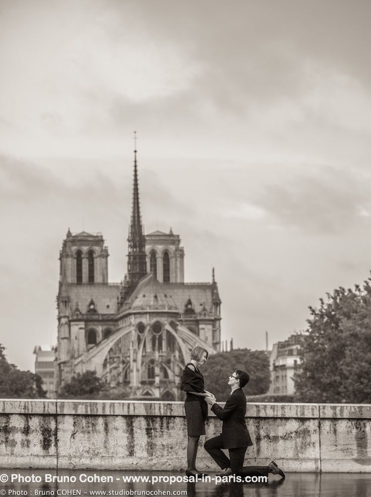surprise proposal in paris from paris front to notre dame cathedral