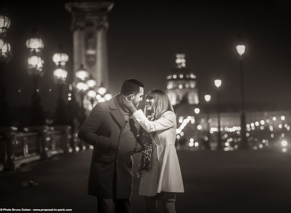 portrait couple face to face walk on the road in paris at night proposal engagement session black an white love smile