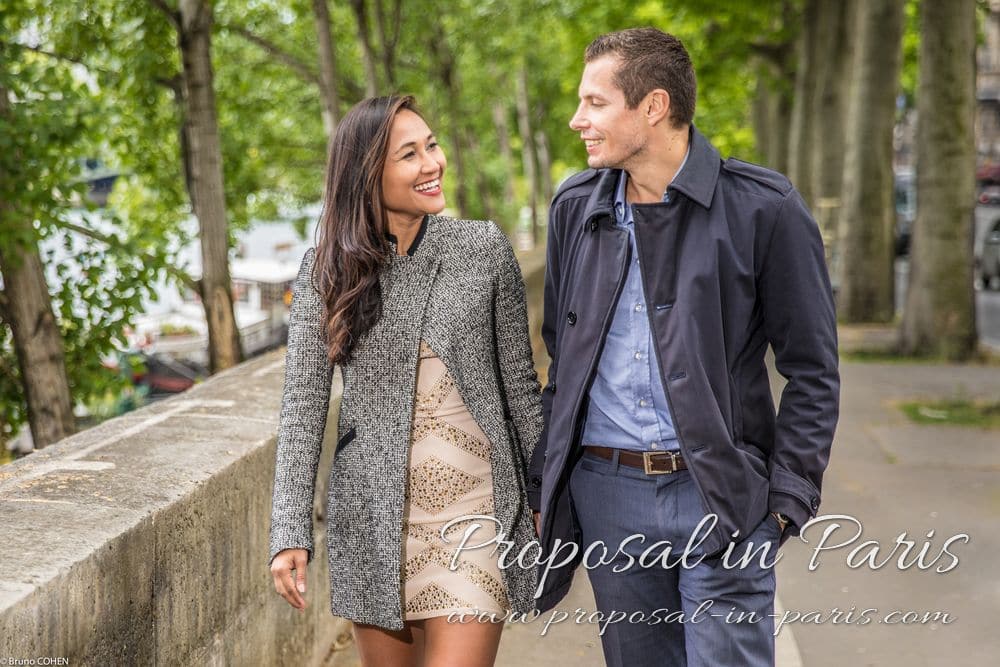 portrait couple holding hands and walk in paris near Eiffel Tower