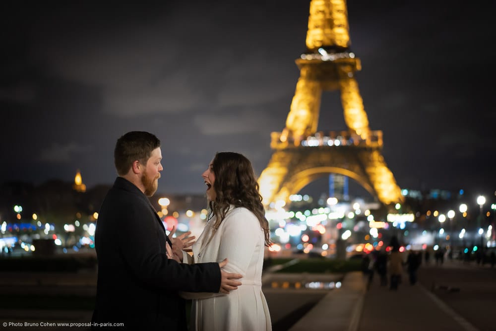 proposal emotions front of Eiffel Tower at night
