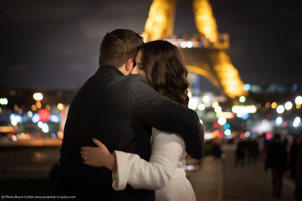 couple in love in Trocadero front of Eiffel Tower at night