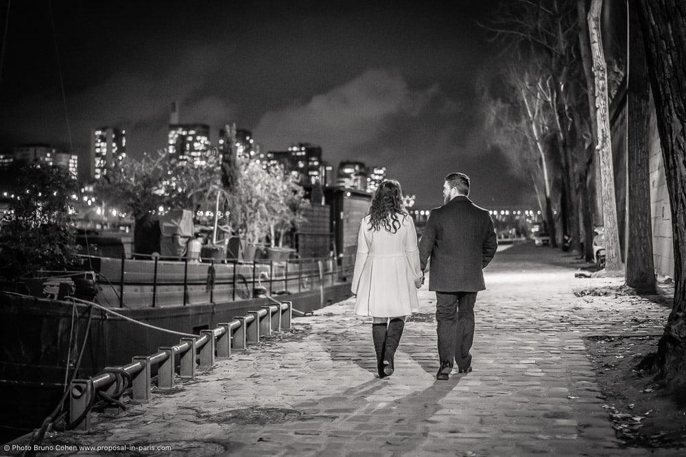 couple walking at night in paris black and white