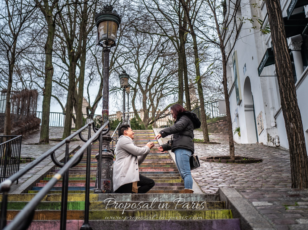 Marriage proposal on stairs near Sacre Coeur