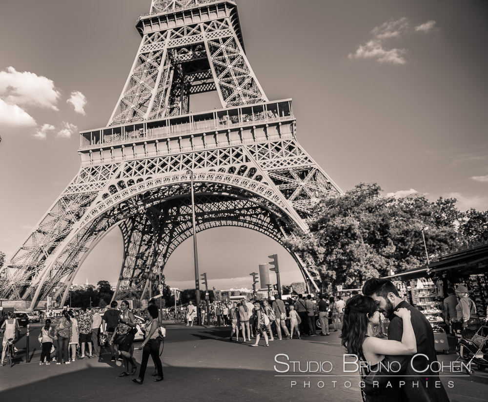 proposal in paris couple in love forehead against forehead front of eiffel tower black in white summer 
