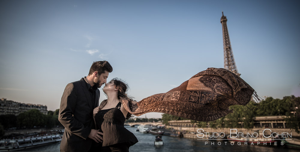 fashion portrait couple kissing on bir hakeim bridge front of eiffel tower in paris romantic emotions love summer at sunset 