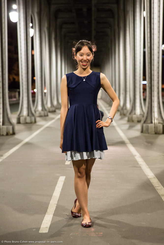 fashion portrait asian lady in dress under Bir Hakeim bridge in paris by night